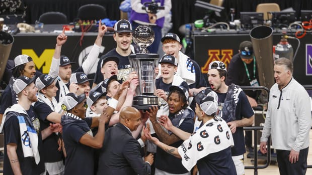 Purdue Boilermakers players celebrate after winning Big Ten Conference Tournament Championship against the Penn State Nittany Lions at United Center.